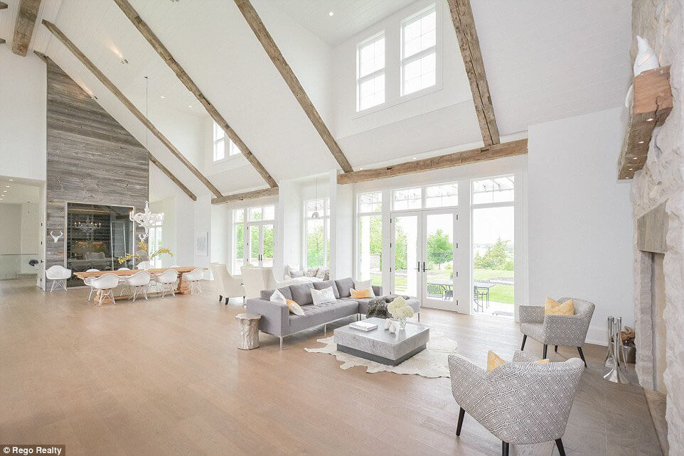 Justin Biebers living room with high ceilings and bright windows