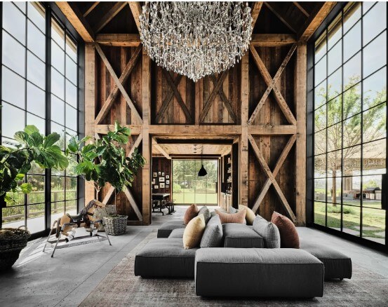 Ashton Kutcher and Mila Kunis' barn-inspired living room with floor to ceiling industrial windows