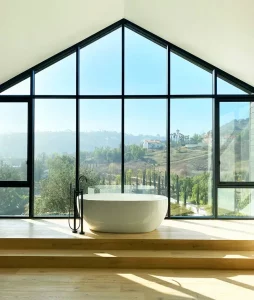 Bathroom view of Matthew Stafford's home with large picture window looking out into the California cliffside 