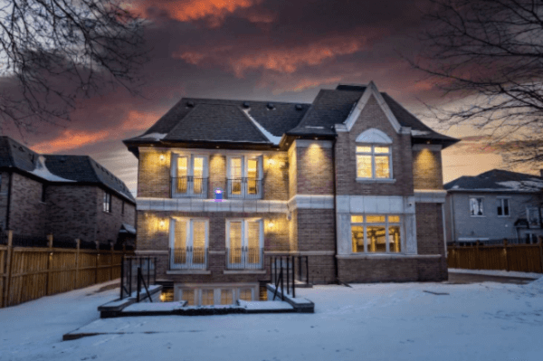 A photo of the back of Kyle Lowry's Toronto home at dusk in winter.