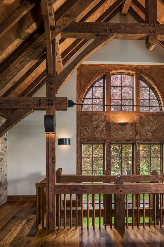 A photo of large, two story wood windows.