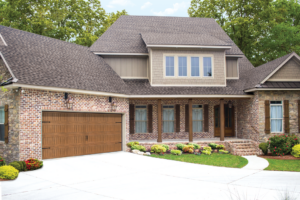 Front of house with matching windows, doors, and garage.